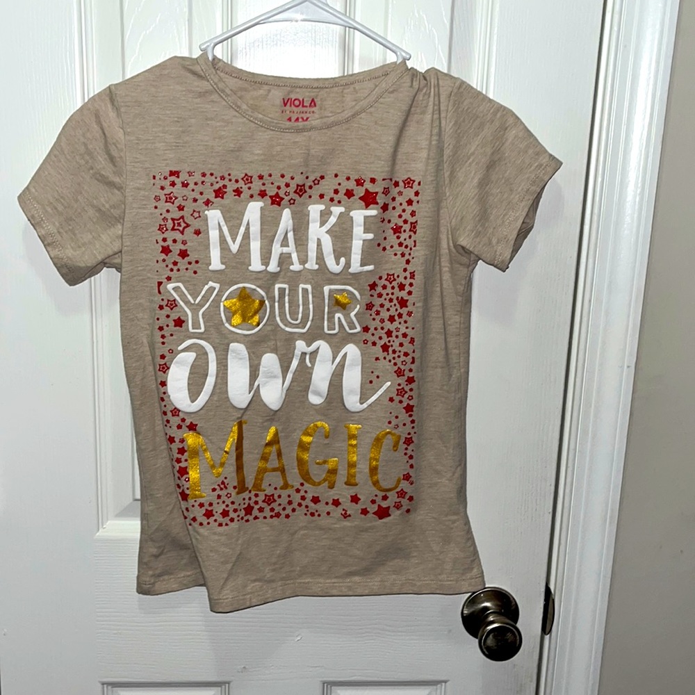 brand: viola. size: 14 year old. color: white, red, gold, writing on the front